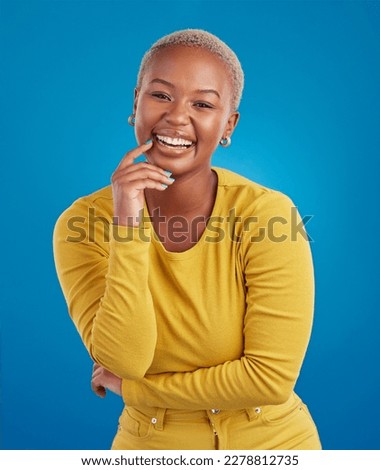 Portrait, happy and black woman in studio smile, cheerful and laughing on mockup, space or blue background. Face, joy and female laugh, joke and silly humor, carefree and having fun while isolated