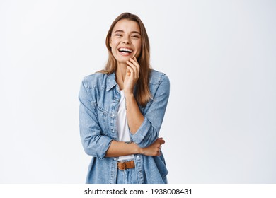 Portrait Of Happy Blond Woman In Casual Clothes, Laughing And Having Fun, Smiling Cheerful At Camera, Standing Against White Background