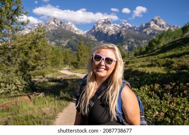 Portrait Of A Happy Blonde Woman Hiker On The Trail Of Grand Teton National Park