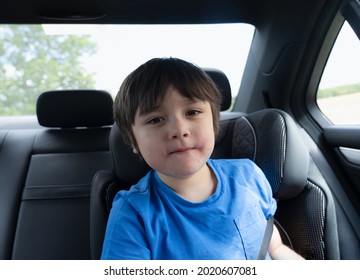 Portrait Happy Boy With Messy Face Of Strawberry Sitting In Car. Boy Siting In Safety Car Seat Looking At Camera With Smiling Face, Cute Child With Funny Face.