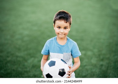 Portrait Happy Boy Sitting On Football Stock Photo 2144248499 