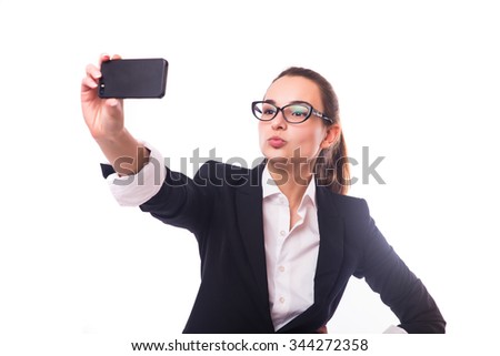 Portrait of a happy business lady blinking her eye while taking selfie with glasses