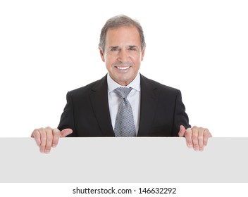 Portrait Of Happy Business Man Holding Blank Placard On White Background