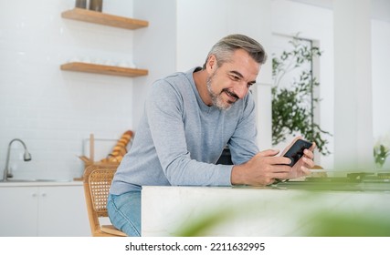 Portrait Of Happy Business Senior Caucasian Man With Casual Cloths Work In Home Office Desk Using Smart Phone. Small Business Employee Freelance Online  Marketing  Tele Market, Retire Leisure Concept