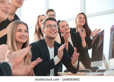 portrait of a happy business team in the workplace. - Shutterstock ID 1668065842