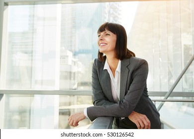 Portrait of happy business woman looking confident