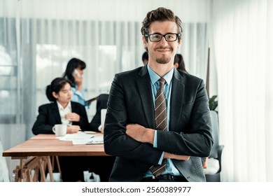 Portrait of happy businessman looking at camera with motion blur background of business people movement in dynamic business meeting. Habiliment - Powered by Shutterstock