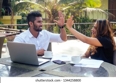 Portrait Of Happy Businesswoman And Businessman At Summer Tropical Cafe.freelance And Remote Work.woman And Arab Man Couple In Love Work Together On The Shore Of India Ocean