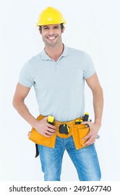 Portrait Of Happy Carpenter Wearing Hard Hat Over White Background