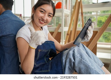 Portrait Of Happy Carpenters Designing And Planing Wood Products In Workshop, Smiling Couple Of Joiners In Joinery, Woodworking Job Concept