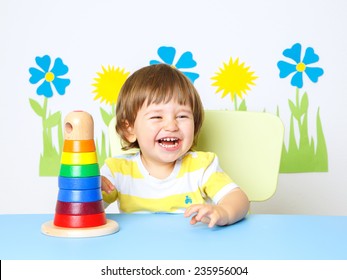 Portrait of a Happy cheerful baby at kindergarten or playgroup