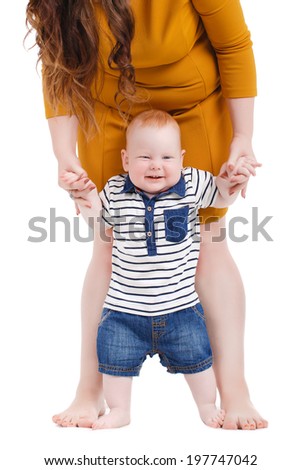 portrait of Happy cheerful family. Mother and baby kissing, laughing and hugging. Playful mood