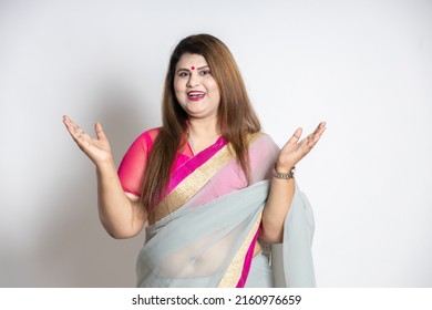 Portrait Of Happy Cheerful Overweight Mature Beautiful Indian Woman Wearing Saree With Open Arms And Hands Raised Gesture Isolated On White Background,