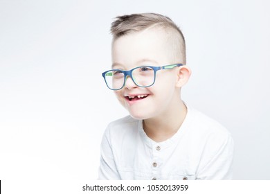 Portrait Of Happy Child With Down Syndrome.