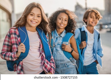 Portrait of happy childrens looking at camera outdoors - Shutterstock ID 1508727155