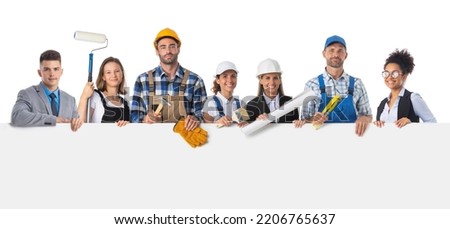 Portrait of happy construction workers and managers holding blank billboard isolated on white background, empty copy spcae for text content