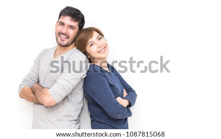 Portrait of happy couple smiling on white background. Young interracial asian and caucasian man woman couple have fun in new year eve and valentines day, Family love lifestyle diversity people concept