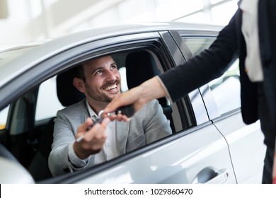 Portrait Of Happy Customer Buying New Car