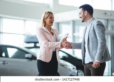 Portrait of happy customer buying new car - Shutterstock ID 1417127948