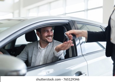 Portrait Of Happy Customer Buying New Car