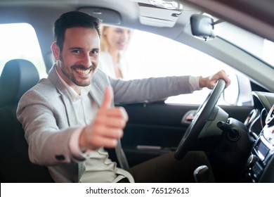 Portrait Of Happy Customer Buying New Car