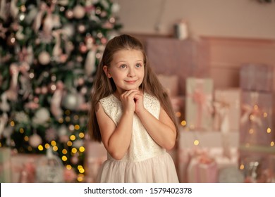 Portrait Of A Happy Cute Girl Of 8-9 Years Old In The New Year Interior