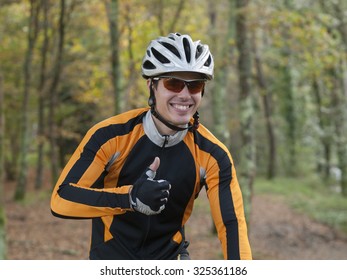 Portrait Of A Happy Cyclist With Ok Symbol