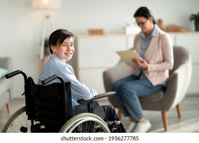 Portrait Of Happy Disabled Teen Boy In Wheelchair Looking At Camera And Smiling, Copy Space