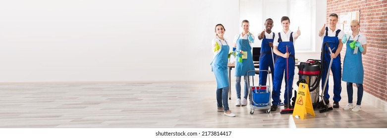 Portrait Of Happy Diverse Janitors In The Office With Cleaning Equipment Showing Thumb Up Sign - Powered by Shutterstock