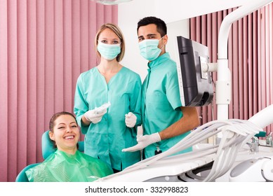 Portrait Happy Doctor,female Assistant And Patient At Surgery Office