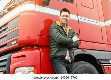 Portrait Of Happy Driver At Modern Truck Outdoors