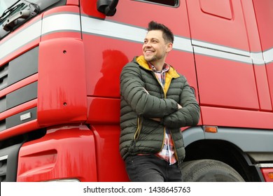 Portrait Of Happy Driver At Modern Truck Outdoors