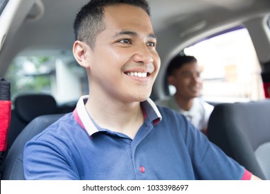 portrait of happy driver taking his customer by car
