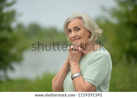 Portrait of a happy elderly woman posing