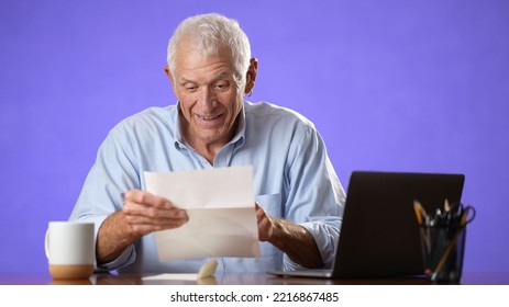 Portrait Of Happy Excited Male Elderly Man Opening Mail Letter Reading Good News Celebrating Success, Receiving Loan Approval, Salary Bonus, Get Promoted Concept Isolated On Solid Purple Background