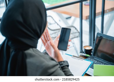 Portrait Of Happy Excited Muslim Woman Suprised While Looking At Her Phone