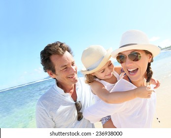 Portrait Of Happy Family At The Beach