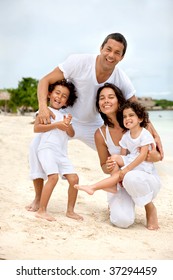 Portrait Of A Happy Family At The Beach