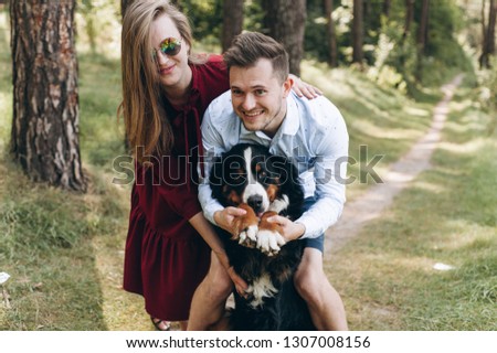 
Portrait of a happy family with a dog