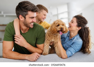 Portrait Of Happy Family With A Dog Having Fun Together At Home.