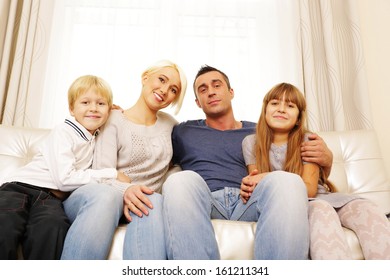 Portrait of happy family at home - Shutterstock ID 161211341
