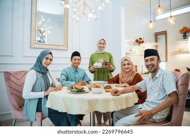portrait of happy family look at camera together in the dining room when breaking fast
