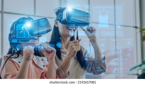 Portrait of happy family mother and asian girl use glasses of technology virtual reality headset for fashion online shopping time summer sale and buy purchases.online shopping VR metaverse technology - Powered by Shutterstock