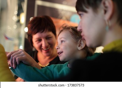 Portrait Of Happy Family In A Museum