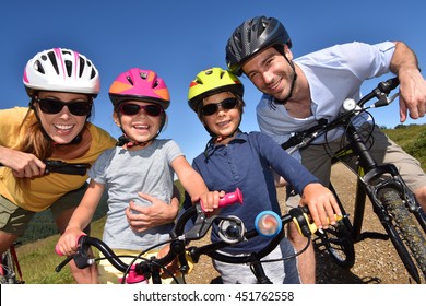 Portrait Of Happy Family On A Biking Day