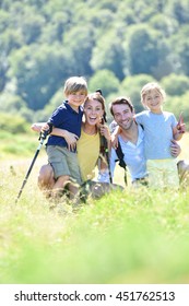 Portrait Of Happy Family On A Hiking Day In The Mountain