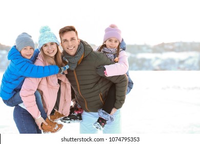 Portrait Of Happy Family Outdoors On Winter Day