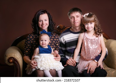 Portrait Of A Happy Family. Photo Studio