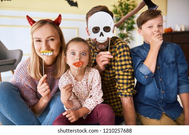 Portrait Of Happy Family Spending Halloween Together At Home