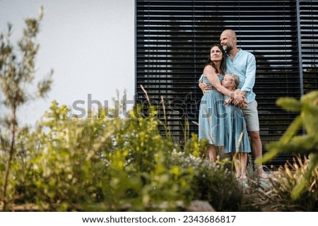 Portrait of a happy family spending time together outdoors